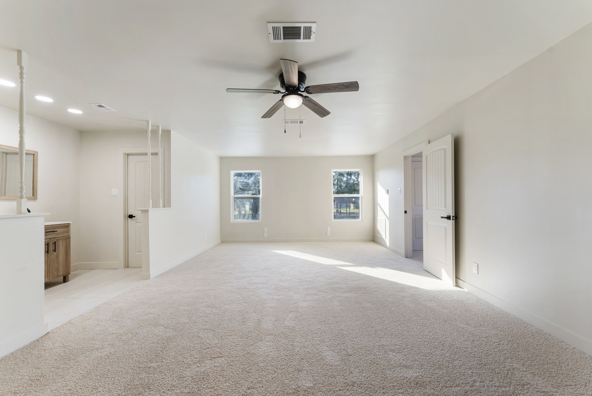 24521 Magnolia Road Hockley, TX 77447 - Photo 25 of 50 a view of a livingroom with a chandelier fan and windows