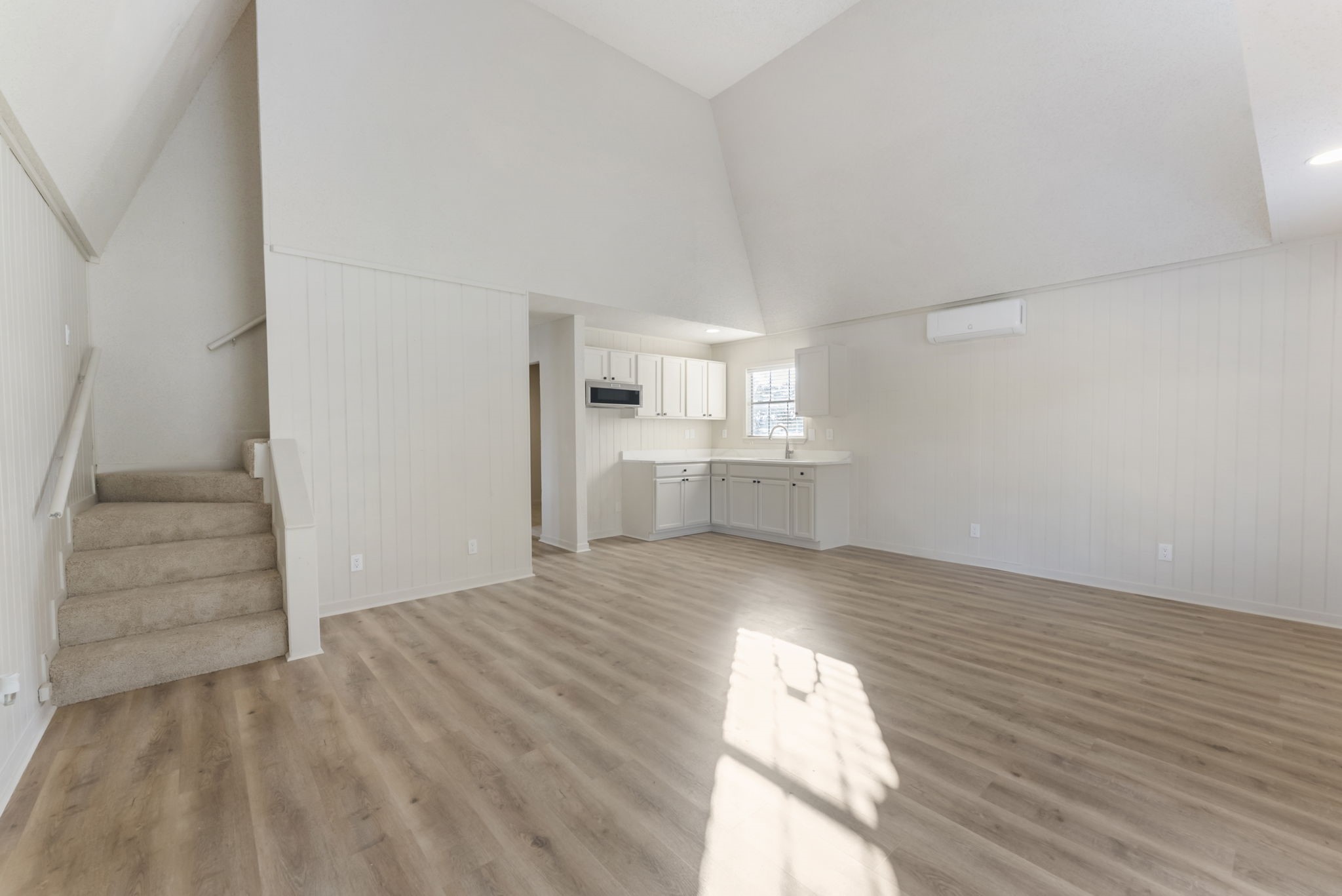 24521 Magnolia Road Hockley, TX 77447 - Photo 30 of 50 a view of empty room with wooden floor and kitchen