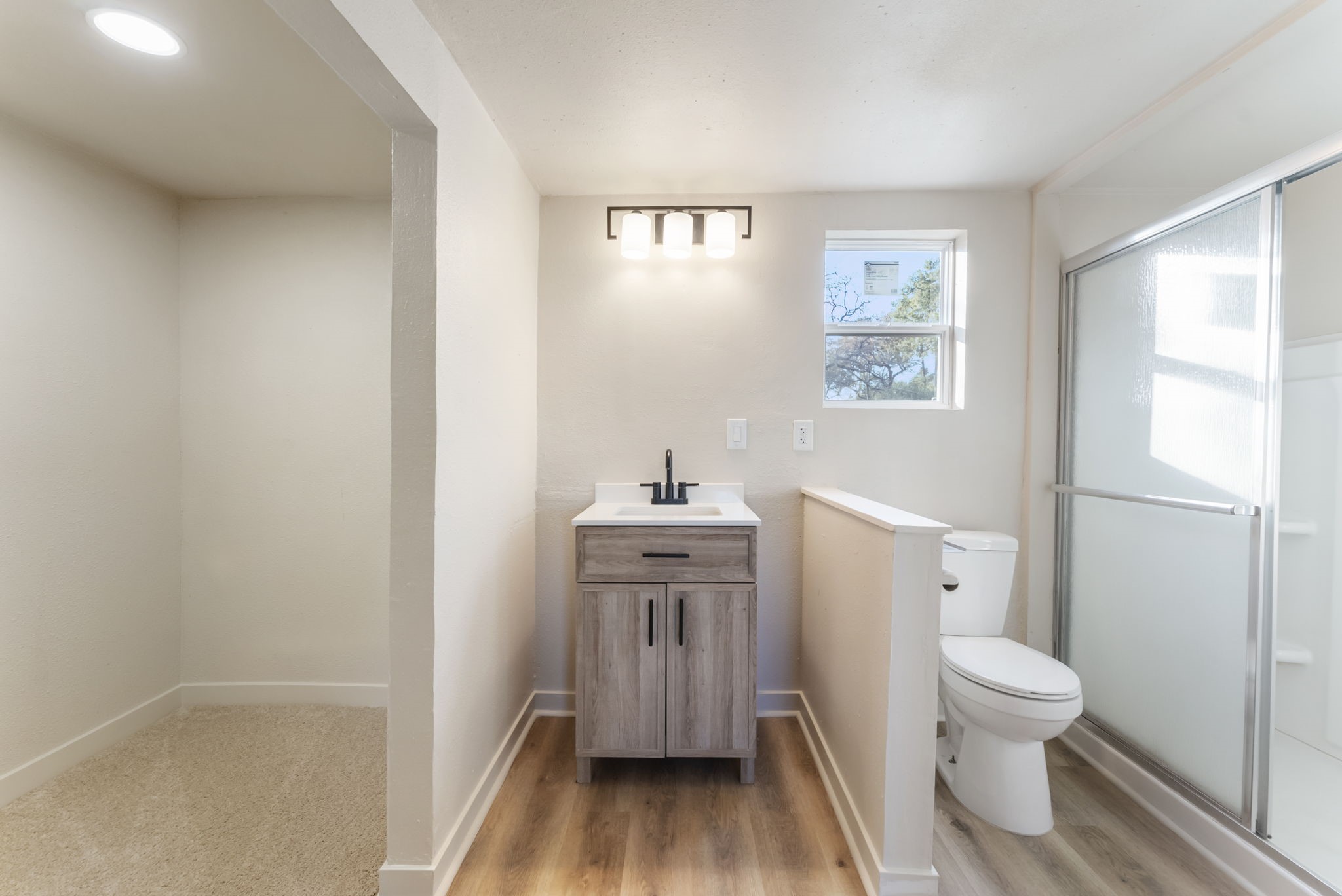 24521 Magnolia Road Hockley, TX 77447 - Photo 36 of 50 a bathroom with a sink a toilet and a mirror