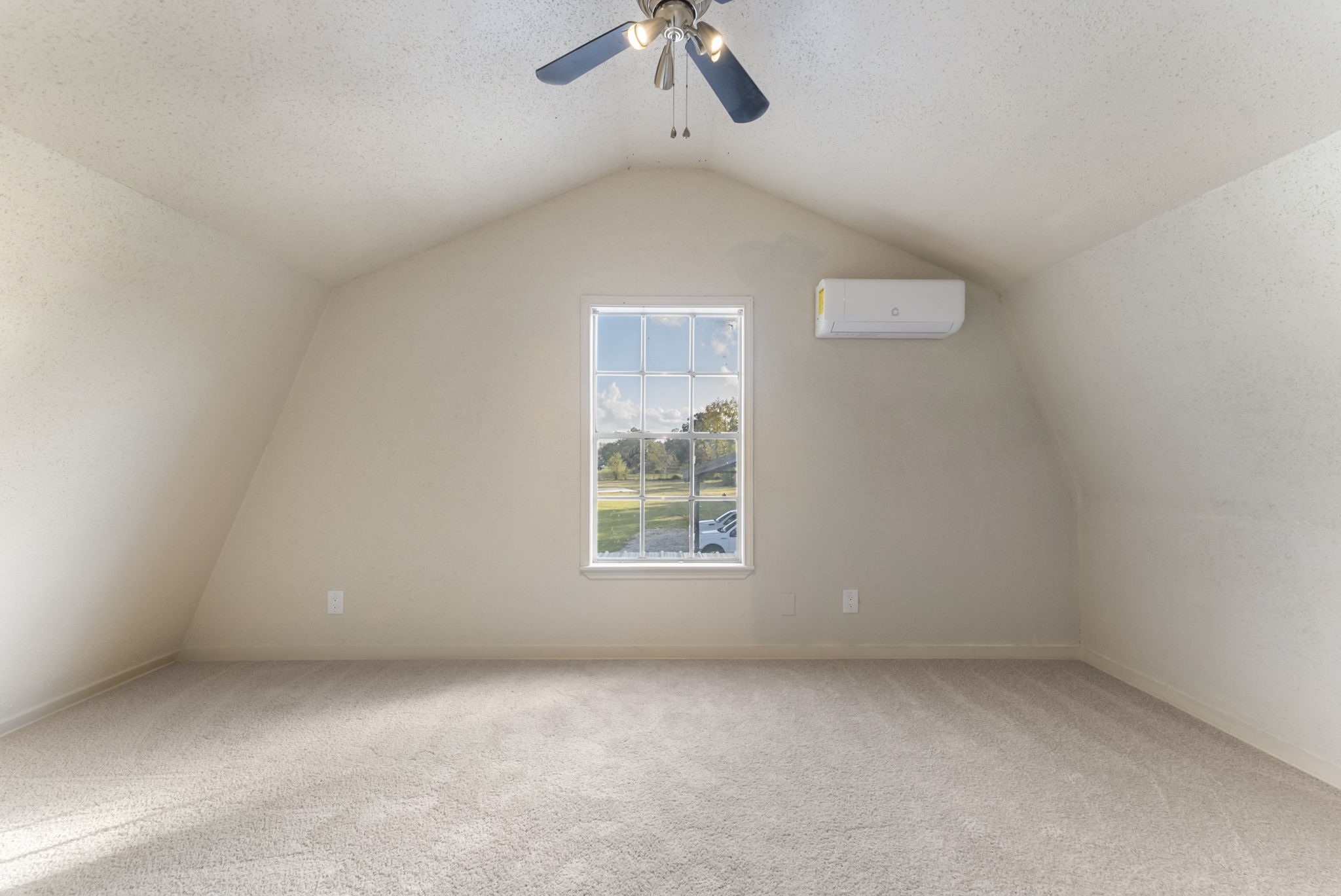 24521 Magnolia Road Hockley, TX 77447 - Photo 40 of 50 an empty room with a window and a ceiling fan