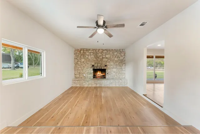 a kitchen with stainless steel appliances granite countertop a refrigerator sink and stove