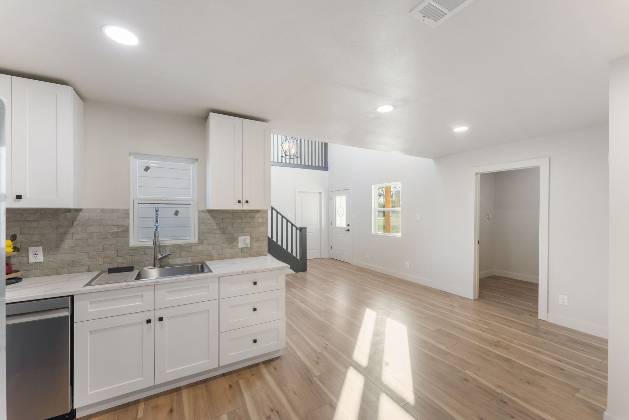 24521 Magnolia Road Hockley, TX 77447 - Photo 8 of 50 Kitchen adjacent to a large laundry room that serves as extra storage as well