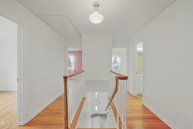 a bedroom with a bed lamp and window