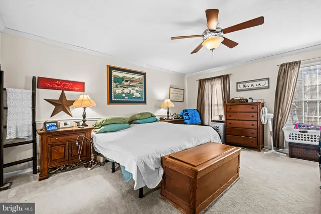 a bed room with furniture and a flat screen tv