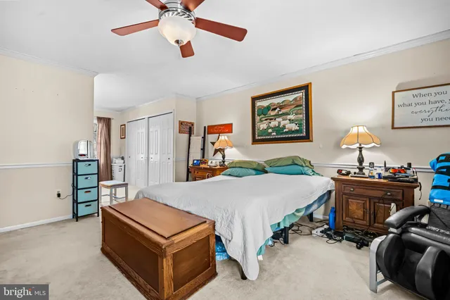 a bed room with a bed and a chandelier