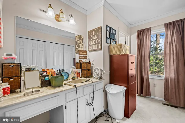 a bathroom with a sink a toilet and shower curtain