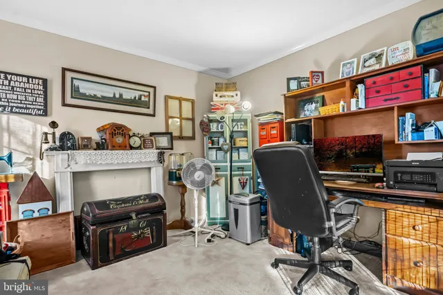 a view of a workspace with furniture and a workspace