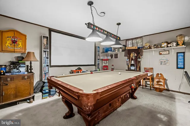a room with furniture and air hockey table