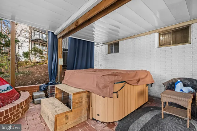 a bedroom with a bed and glass window