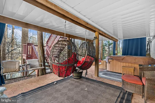 a view of a patio with a table and chairs