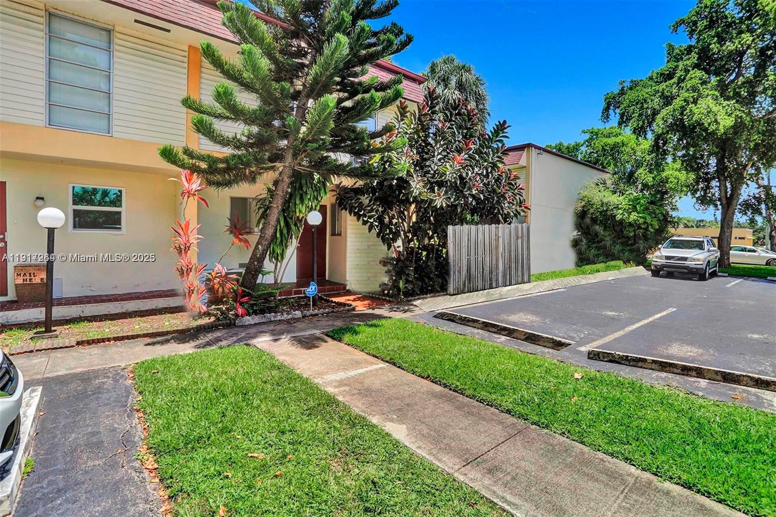 2701 North 34th Avenue, Unit 1D Hollywood, FL 33021 - Photo 2 of 9 a view of a street with a large tree