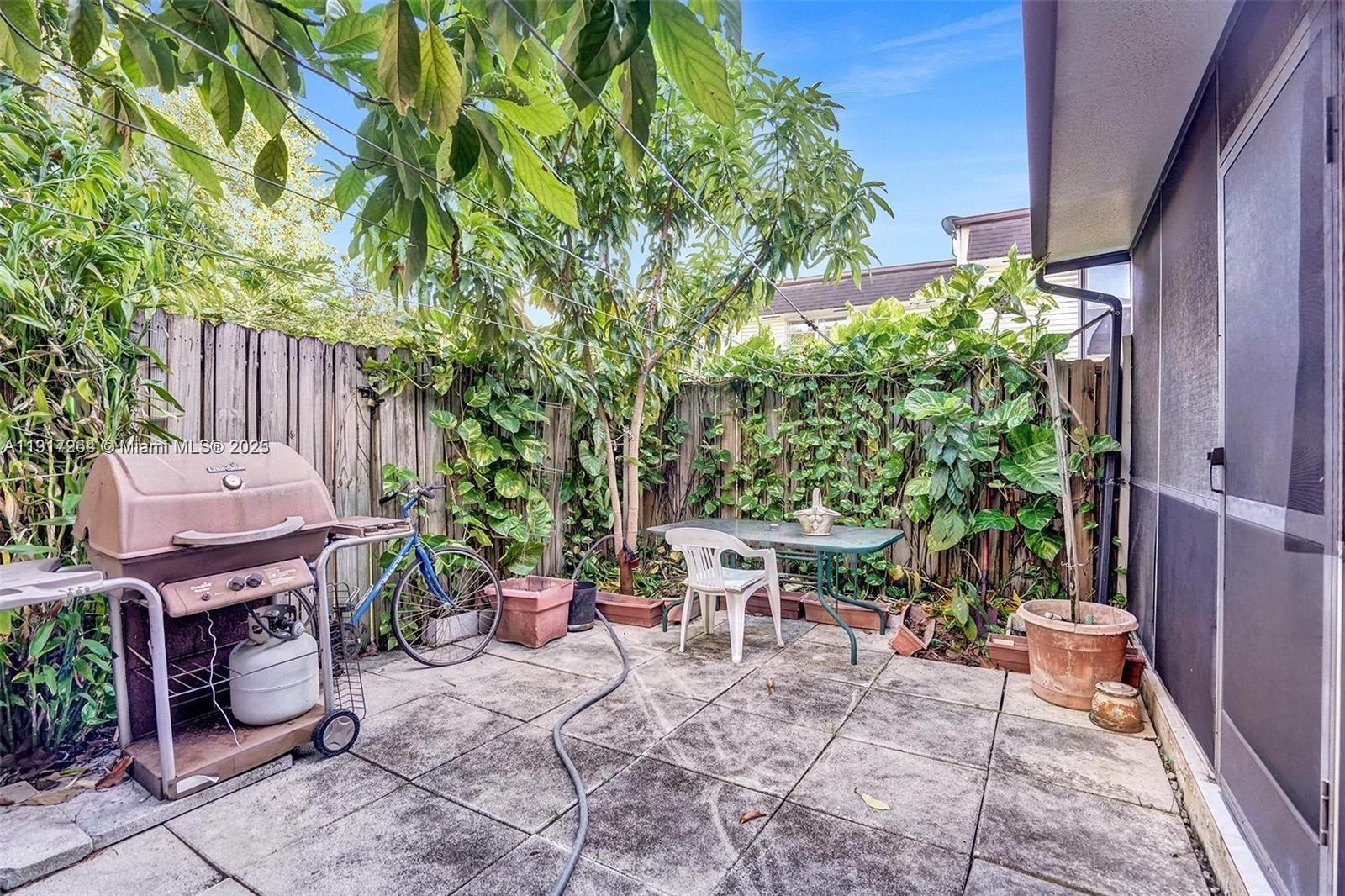 2701 North 34th Avenue, Unit 1D Hollywood, FL 33021 - Photo 5 of 9 a view of a backyard with sitting area