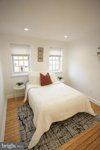a bedroom with a large bed and a window