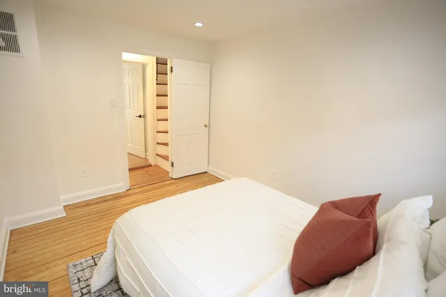 a bedroom with a bed and a cabinets