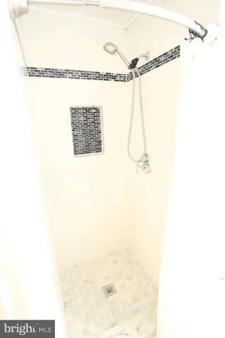 a picture of a bathroom with a shower