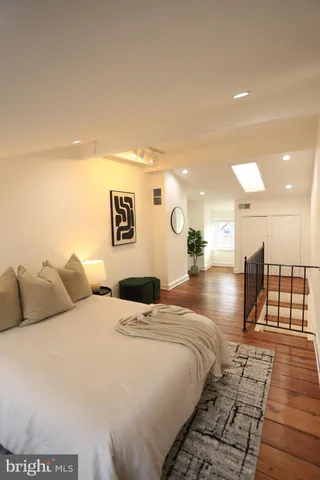 a view of a living room and a wooden floor