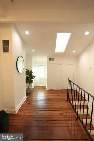 a bedroom with wooden floor