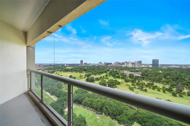 a view of a city skyline from a balcony