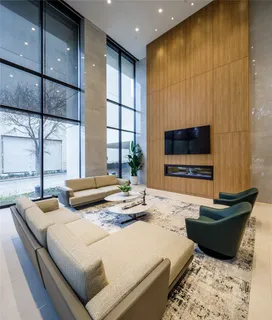 a bedroom with furniture and a flat screen tv