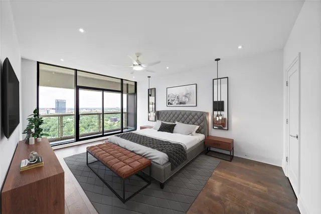 a bedroom with a bed and a large window