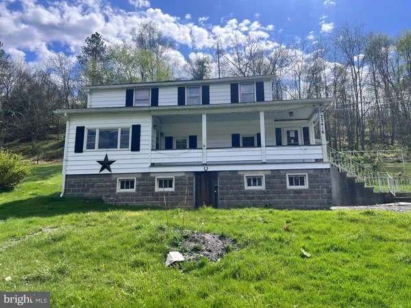 a view of a building with a yard