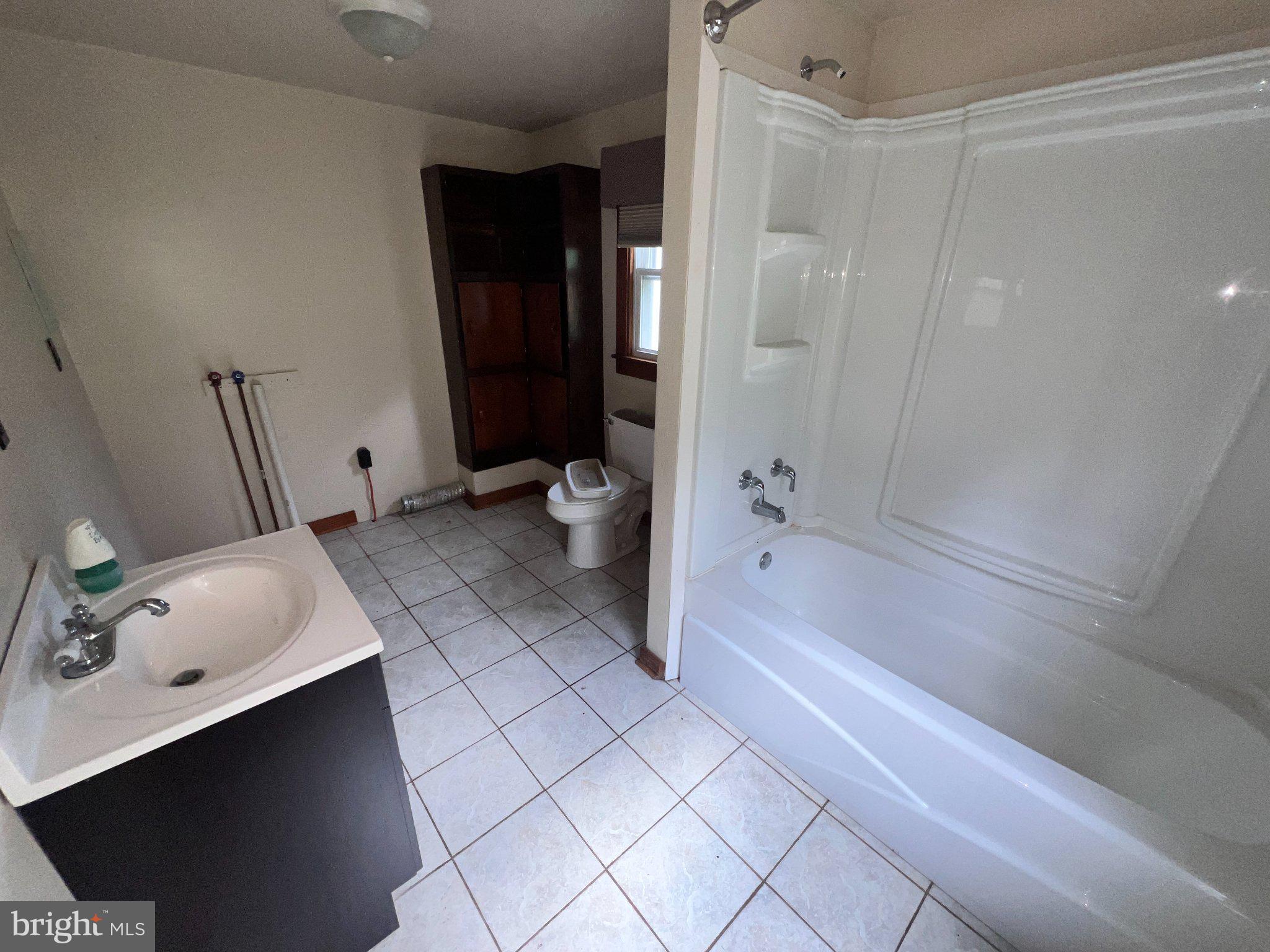22416 Seldom Seen Road Southwest Lonaconing, MD 21539 - Photo 12 of 39 a bathroom with a bathtub sink and toilet
