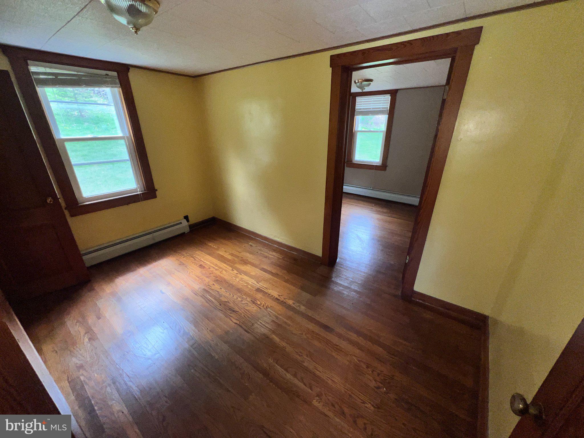 22416 Seldom Seen Road Southwest Lonaconing, MD 21539 - Photo 14 of 39 a view of a room with wooden floor and windows