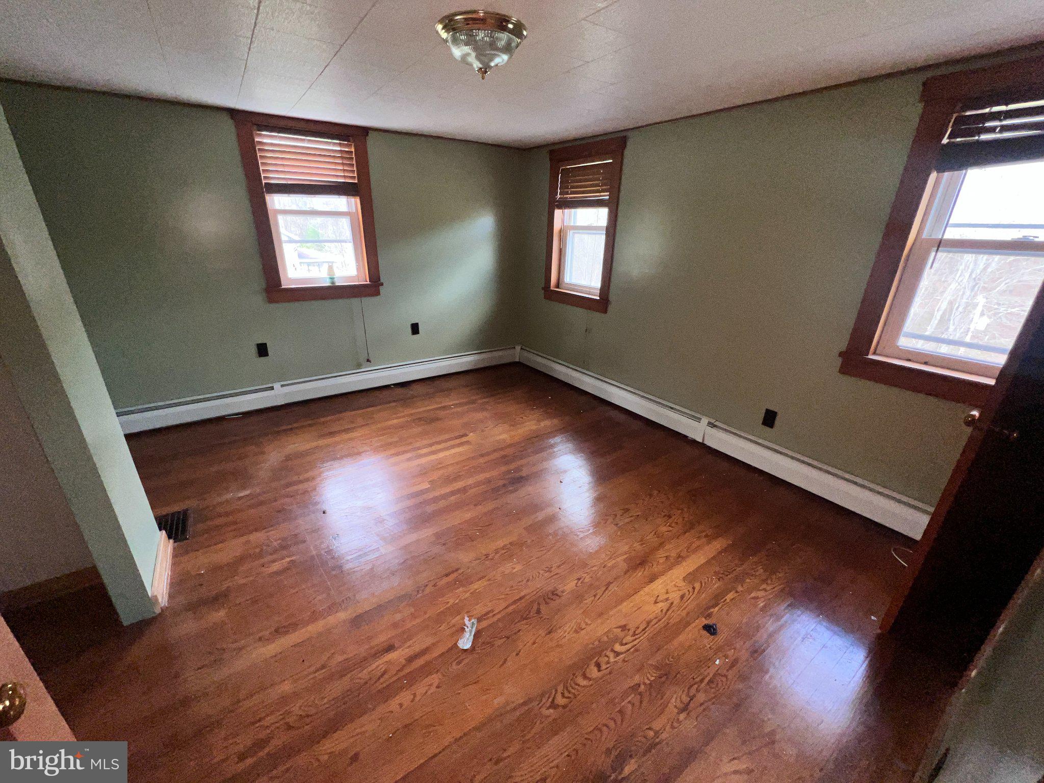 22416 Seldom Seen Road Southwest Lonaconing, MD 21539 - Photo 19 of 39 a view of wooden floor and windows in a room