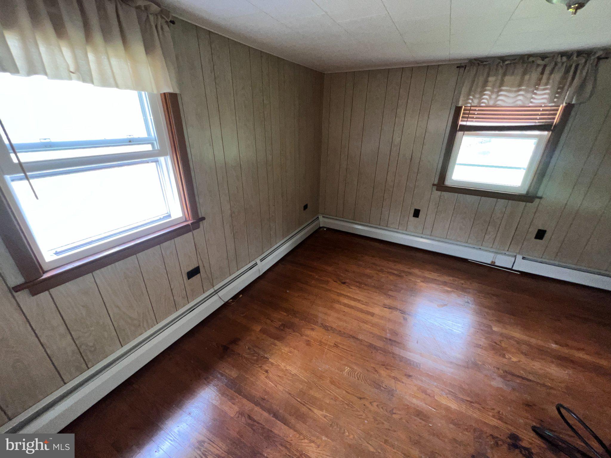 22416 Seldom Seen Road Southwest Lonaconing, MD 21539 - Photo 21 of 39 a view of an empty room with wooden floor and a window