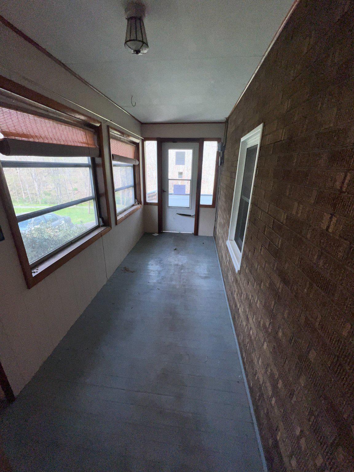 22416 Seldom Seen Road Southwest Lonaconing, MD 21539 - Photo 3 of 39 a view of a hallway with furniture and a window