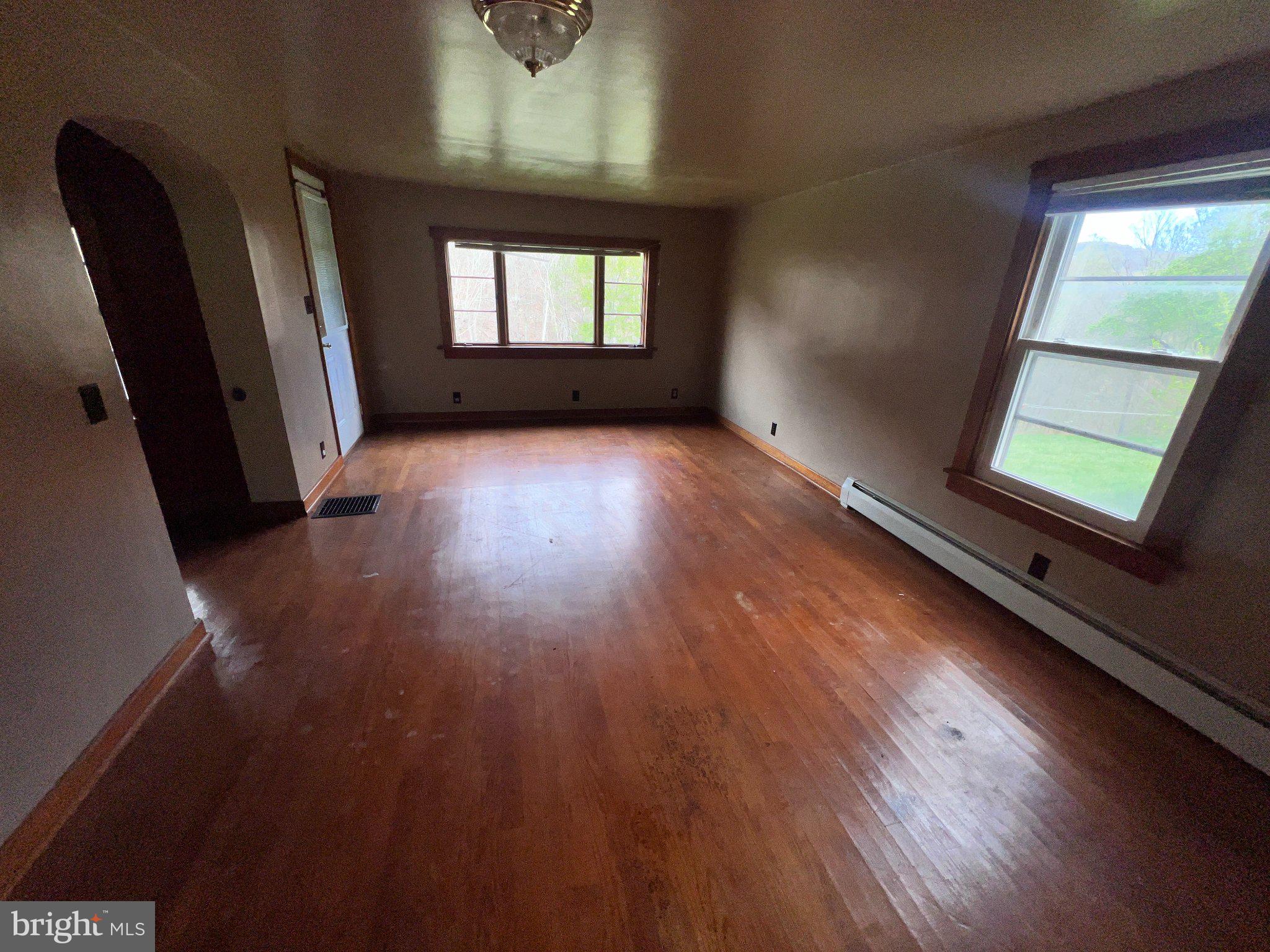 22416 Seldom Seen Road Southwest Lonaconing, MD 21539 - Photo 6 of 39 wooden floor in an empty room with a window