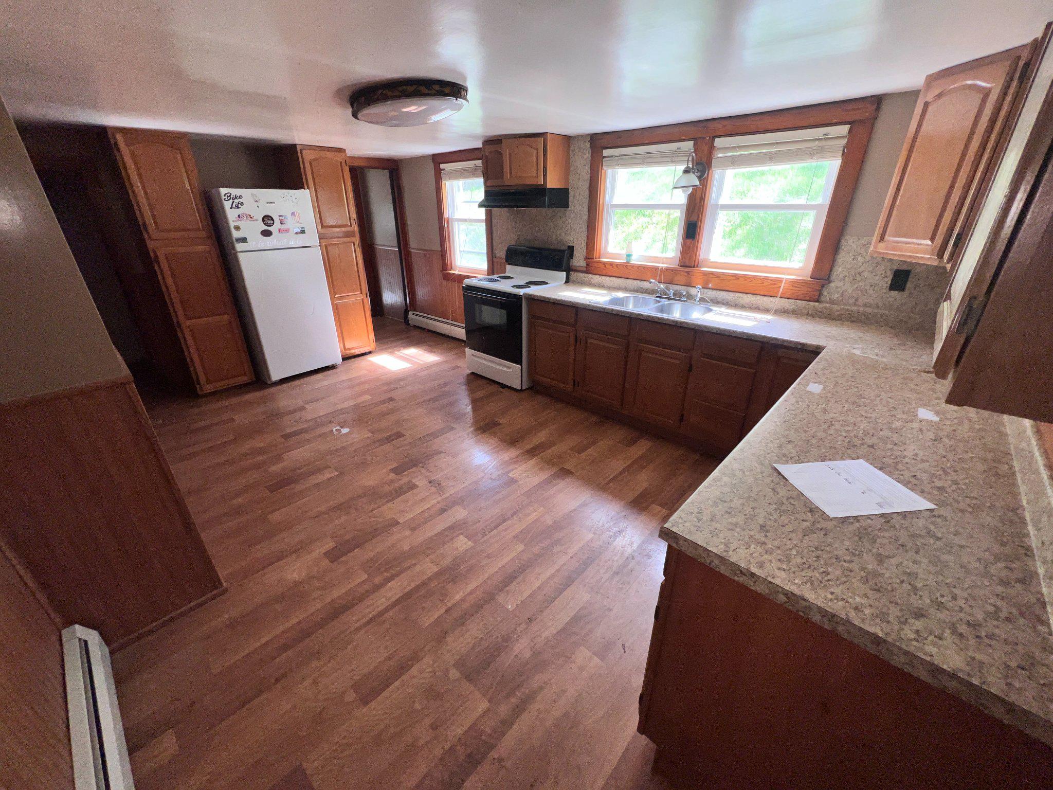 22416 Seldom Seen Road Southwest Lonaconing, MD 21539 - Photo 9 of 39 a large kitchen with cabinets and wooden floor