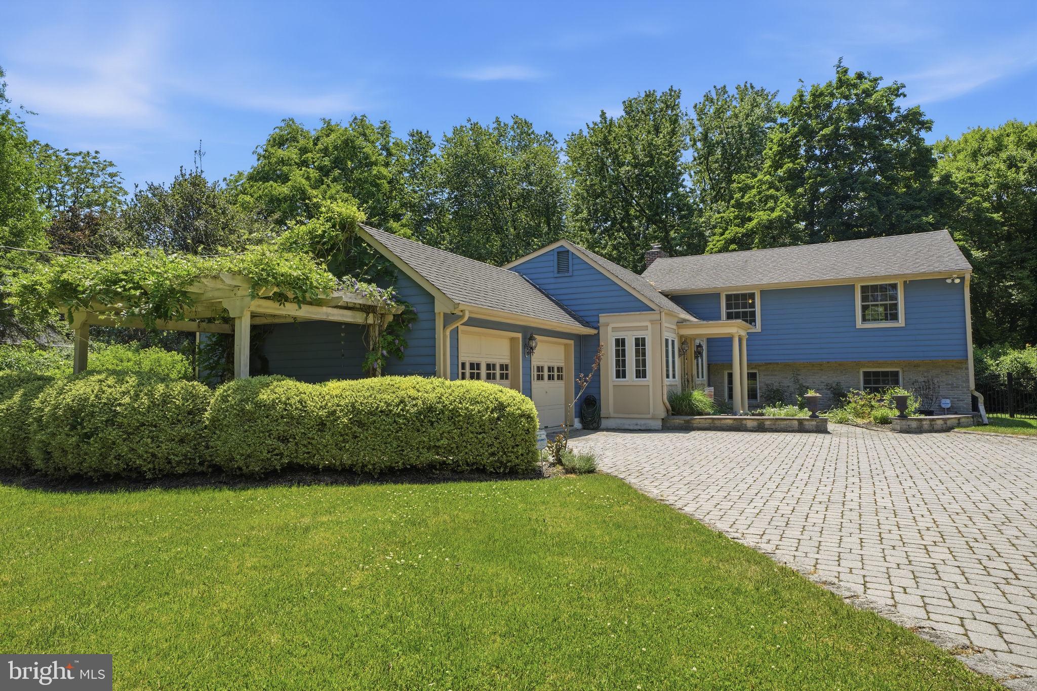621 River Road Yardley, PA 19067 - Photo 6 of 75 a front view of a house with a garden