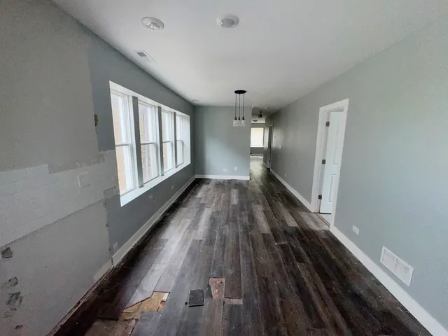 a view of entryway with wooden floor