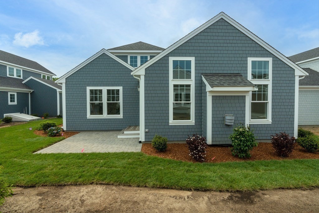 47 Cobblestone Circle Mashpee, MA 02649 - Photo 23 of 25 a view of a house with a yard