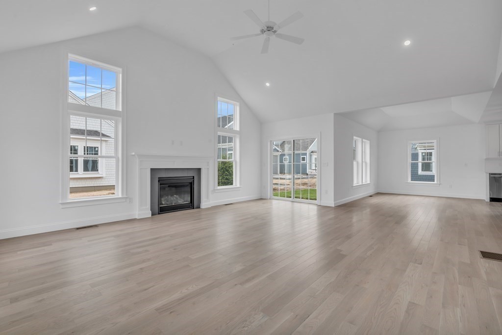 47 Cobblestone Circle Mashpee, MA 02649 - Photo 4 of 25 a view of an empty room with a window and fireplace