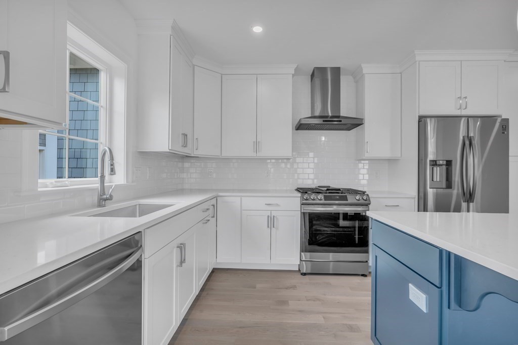 47 Cobblestone Circle Mashpee, MA 02649 - Photo 8 of 25 a kitchen with stainless steel appliances a sink and a stove