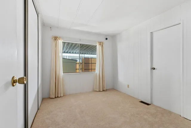 a balcony with table and chairs