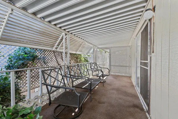 a view of a garage with wooden fence