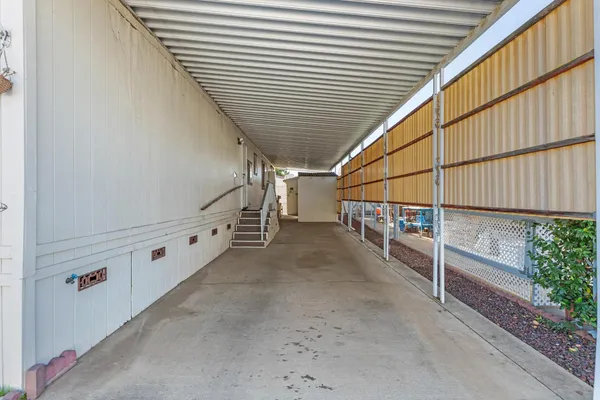 a hallway with sliding door and front door