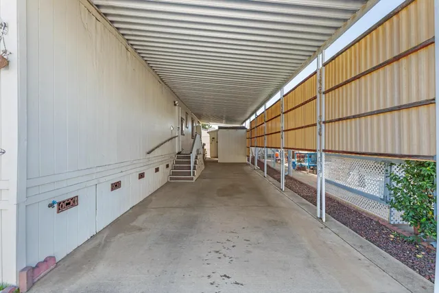 a hallway with sliding door and front door