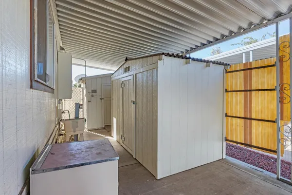 a backyard of house with wooden fence