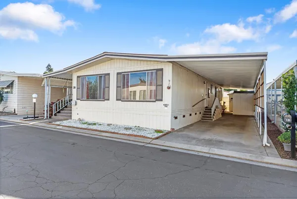 a front view of a house with a garage