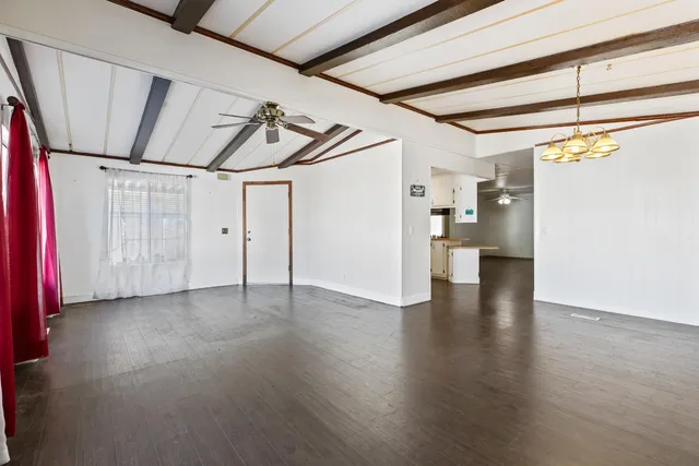 a view of a room with wooden walls