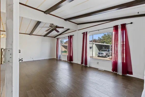 a view of a hardwood & an empty room