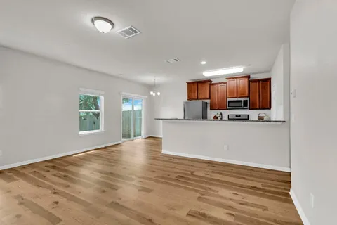 a view of kitchen and wooden floor