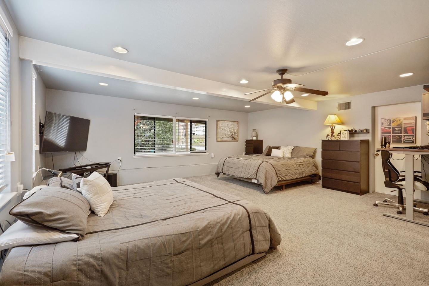 1015 Sycamore Drive Millbrae, CA 94030 - Photo 18 of 26 a bedroom with double bed and a flat tv screen on dresser
