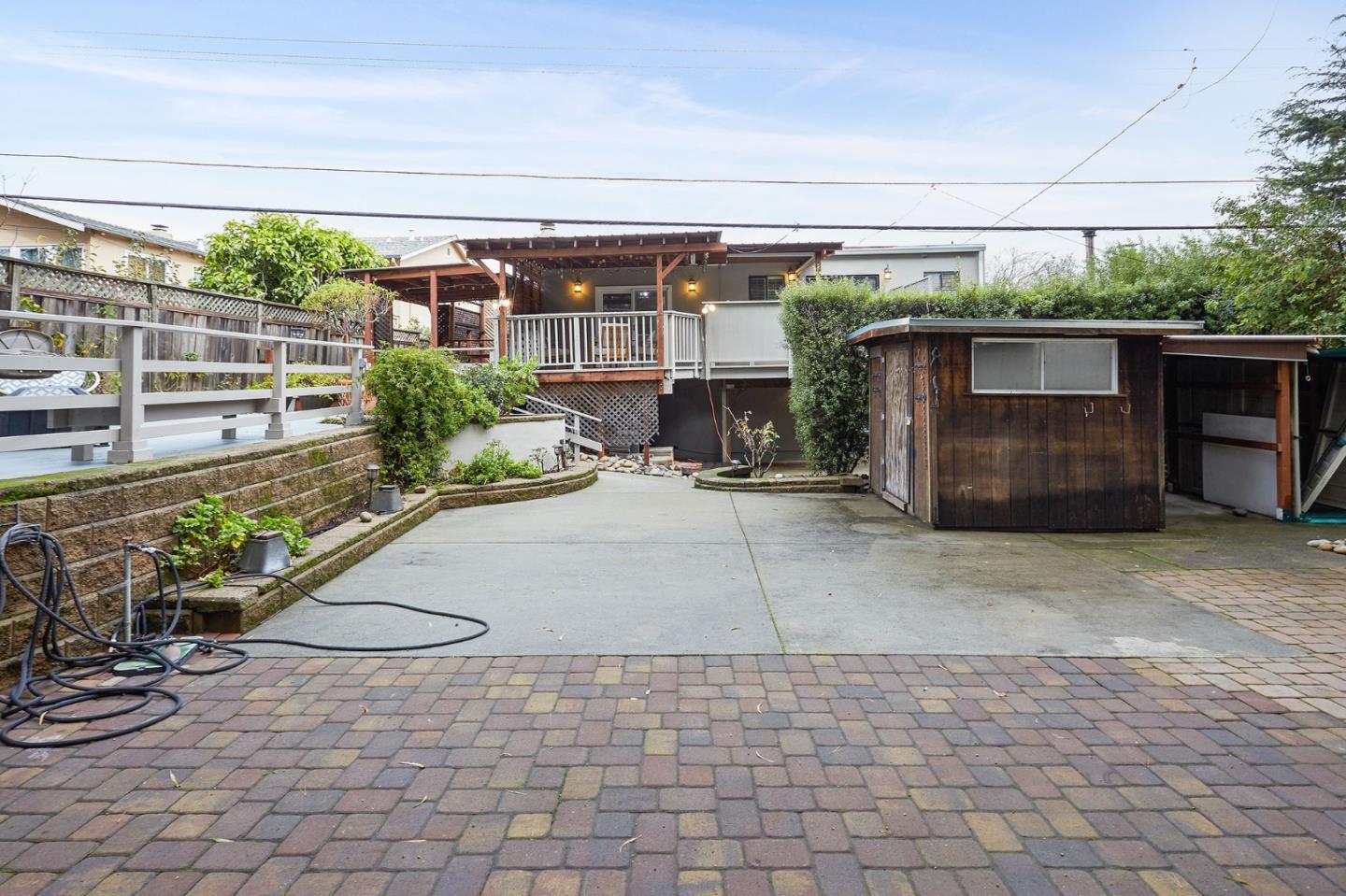 1015 Sycamore Drive Millbrae, CA 94030 - Photo 25 of 26 a view of a backyard with sitting area