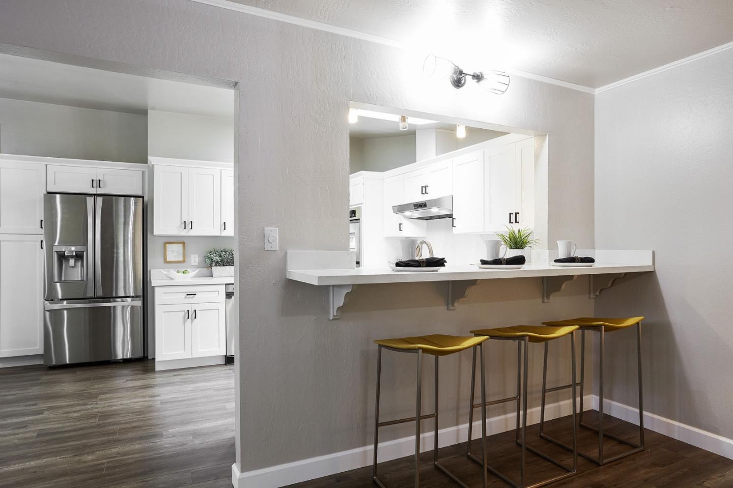 1015 Sycamore Drive Millbrae, CA 94030 - Photo 7 of 26 a kitchen with stainless steel appliances granite countertop a refrigerator and a stove
