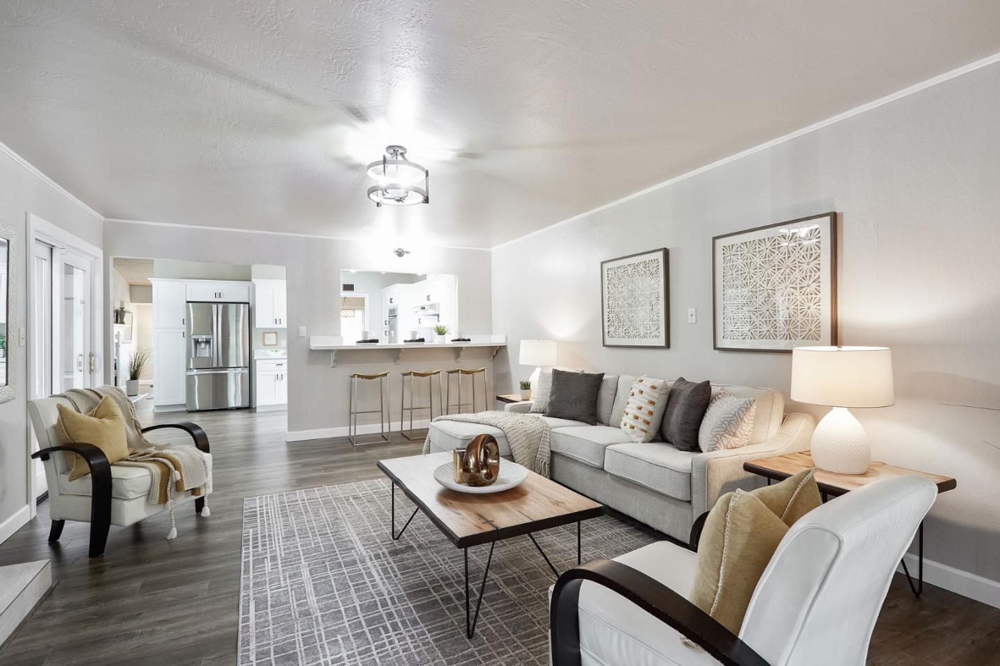 1015 Sycamore Drive Millbrae, CA 94030 - Photo 8 of 26 a living room with furniture a chandelier and a table